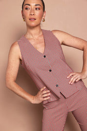 Model Katie wearing size 10 of the Stretch Check Vest in colour Redcheck (Red), from the front, cropped image