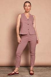 Model Katie wearing size 10 of the Stretch Check Vest in colour Redcheck (Red), from the front, showing the whole outfit