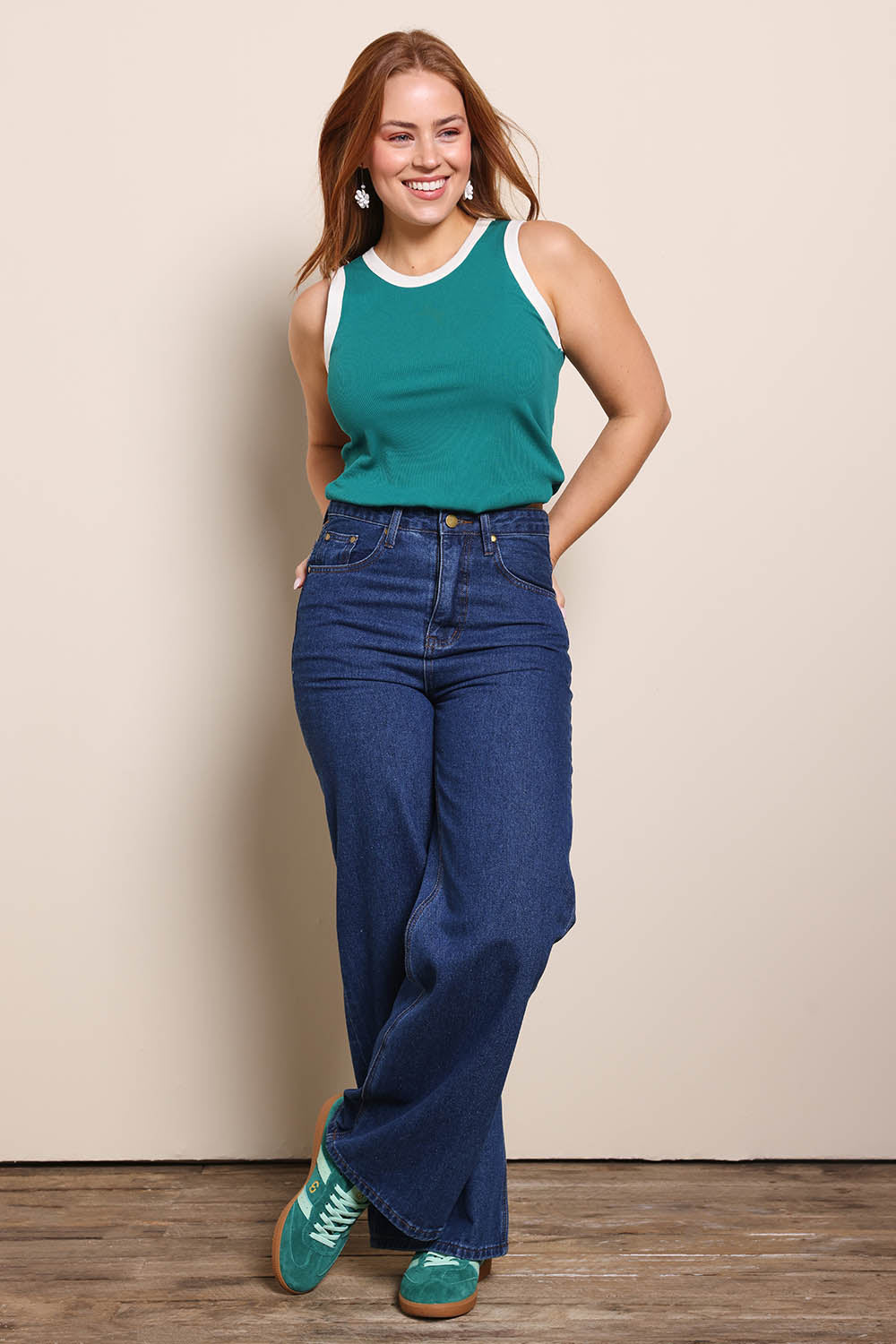 Model Georgiel wearing size 10 of the Cotton Blend Tank Top – Green in colour Green, from the front
