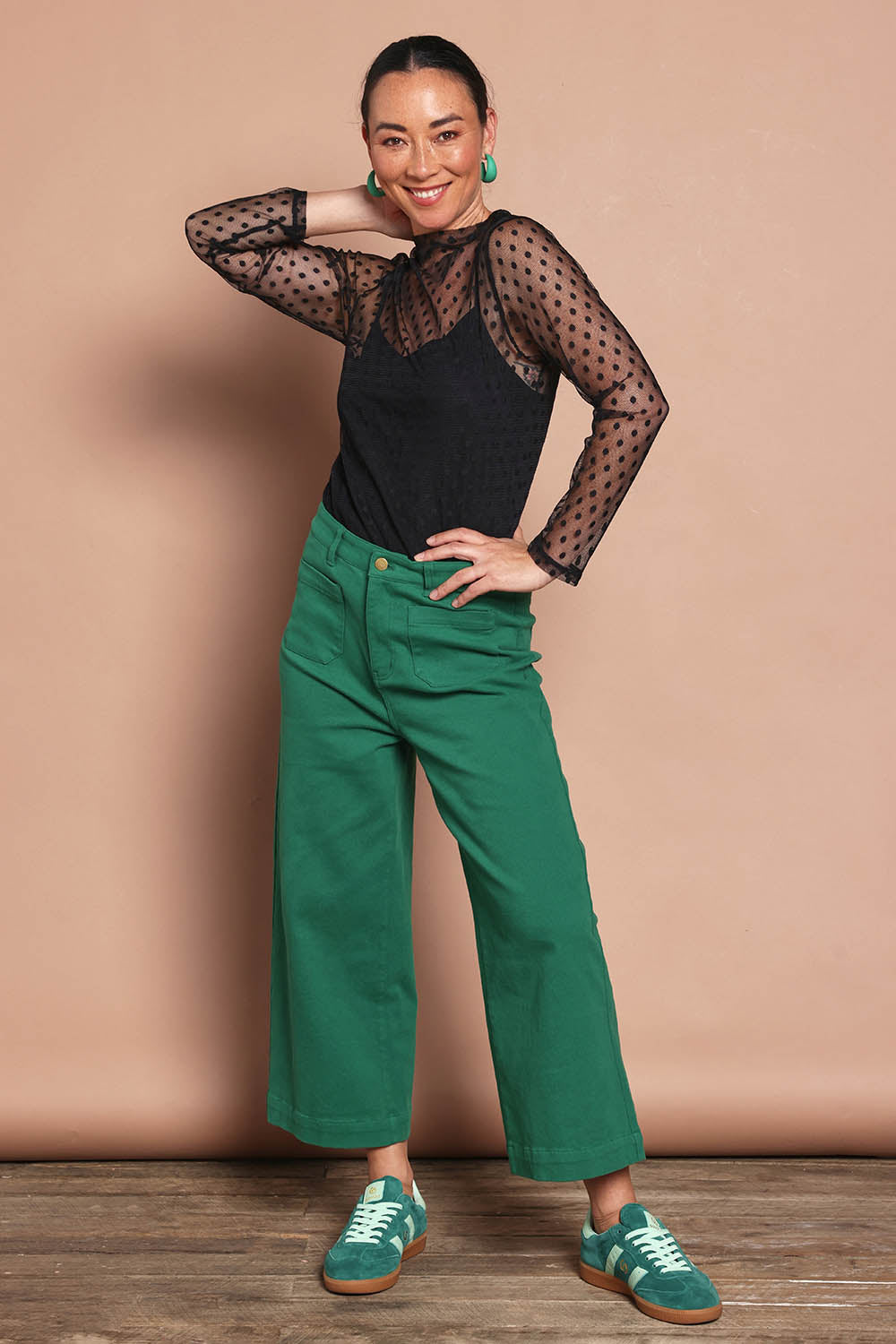 Model Katie wearing size 10 of the Cropped Denim Patch Pocket Jean in colour Green (Green), from the front, showing the whole outfit