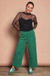 Model Katie wearing size 10 of the Cropped Denim Patch Pocket Jean in colour Green (Green), from the front, showing the whole outfit