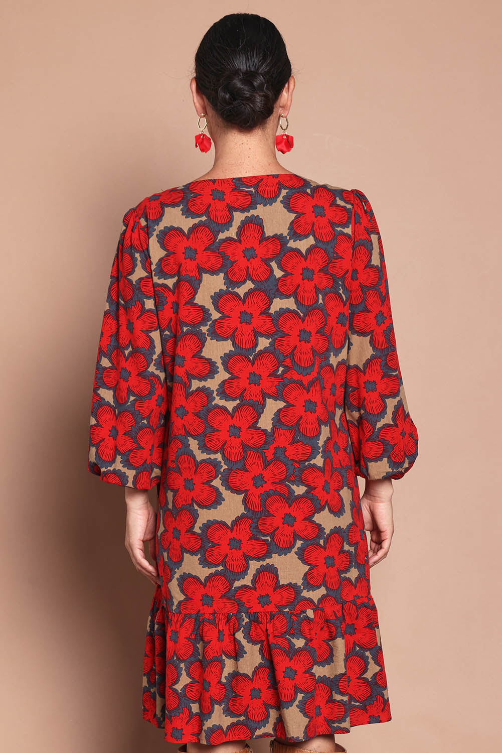 Model Katie wearing size 10 of the Cotton Frill Hem Dress in colour Poppy (Red), from the back
