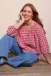 Model Georgiel wearing size 10 of the Cotton Gingham Blouse – Red in colour Red, from the front
