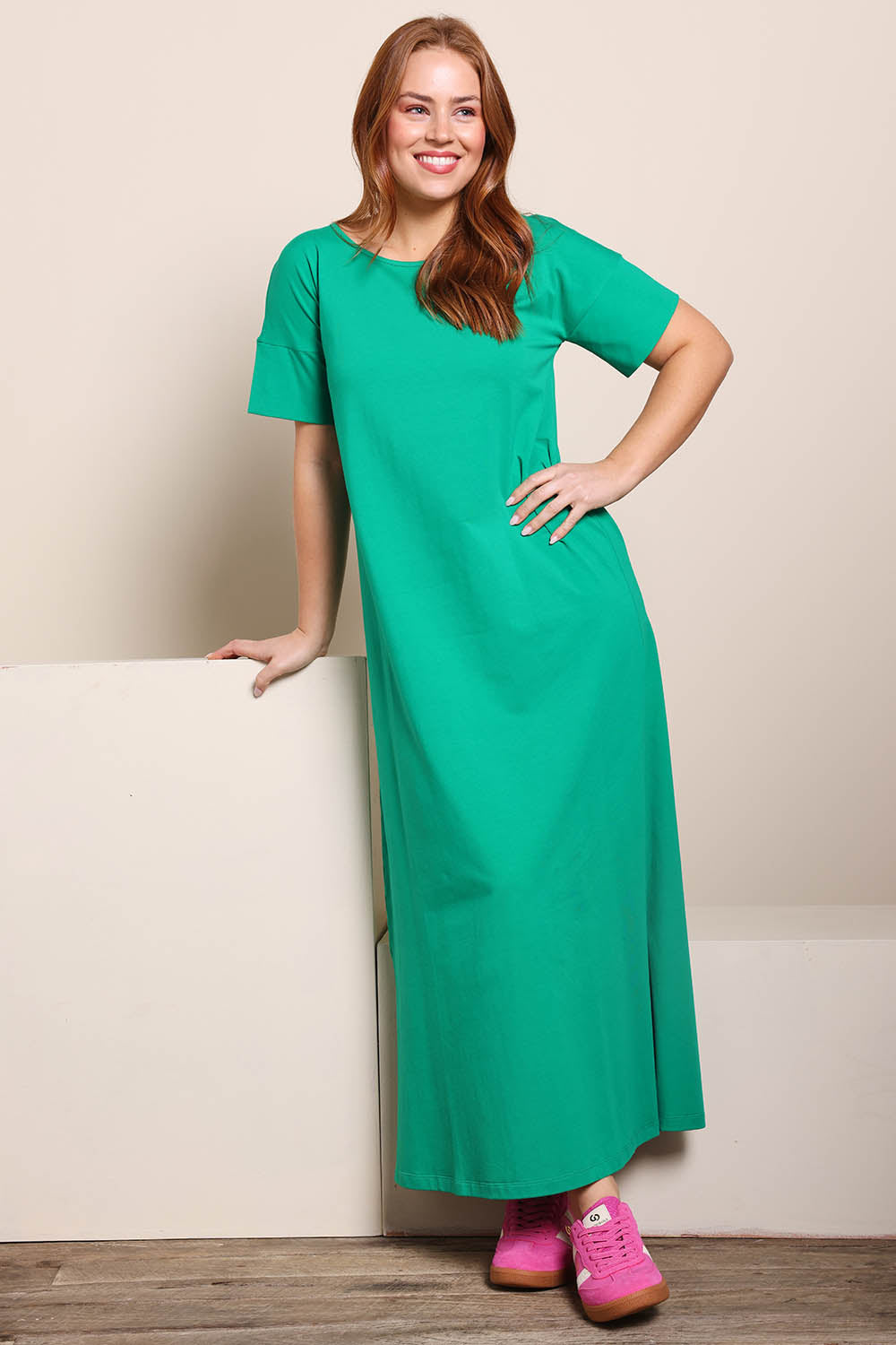 Model Georgiel wearing size 10 of the Cotton Jersey T-Shirt Dress – Green in colour Green, from the front