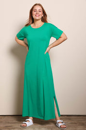 Model Georgiel wearing size 10 of the Cotton Jersey T-Shirt Dress – Green in colour Green, from the front