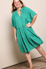 Model Georgiel wearing size 10 of the Relaxed Tiered Dress – Herb in colour Herb, from the front
