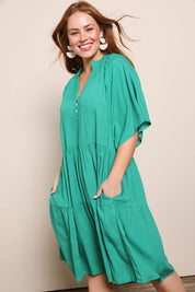 Model Georgiel wearing size 10 of the Relaxed Tiered Dress – Herb in colour Herb, from the front
