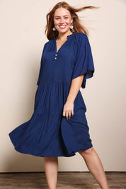 Model Georgiel wearing size 10 of the Relaxed Tiered Dress – Peacoat in colour Peacoat, from the front