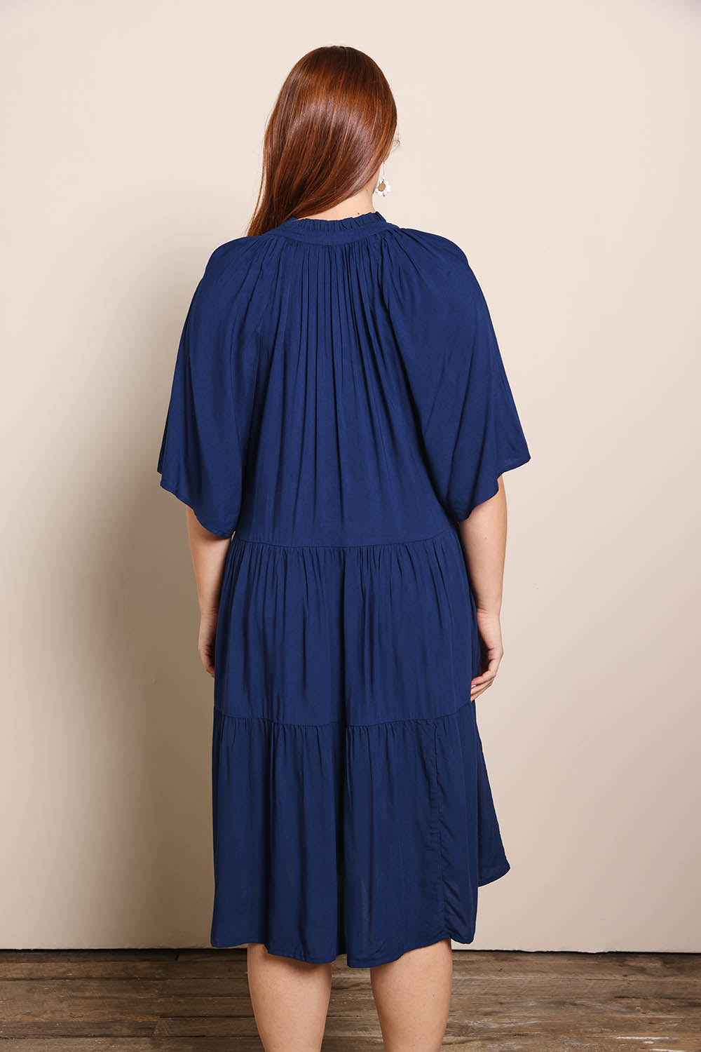 Model Georgiel wearing size 10 of the Relaxed Tiered Dress – Peacoat in colour Peacoat, from the front
