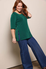 Model Georgiel wearing size 10 of the Side Split Tunic Top – Posygreen in colour Posygreen, from the front