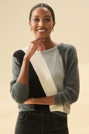 A model wearing the Devon Cotton Cashmere Sweater in colour Dstripes (Grey), from the front, cropped image