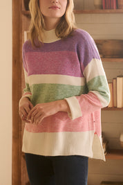 A model wearing the Mock Neck Tunic in colour Sunrise, from the front, cropped image