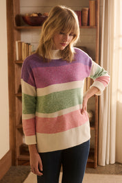 A model wearing the Mock Neck Tunic in colour Sunrise, from the front, cropped image