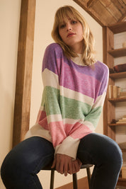 A model wearing the Mock Neck Tunic in colour Sunrise, from the front, showing the whole outfit