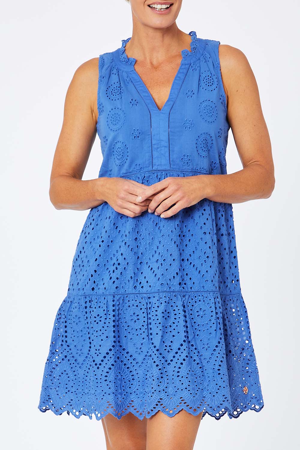 Model Amelia wearing size S of the Lauren Eyelet Dress in colour Amparoblue (Blue), from the front, cropped image