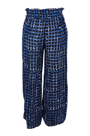 Product shot of the Cassie Pants in colour Plaid (Blue), from the back