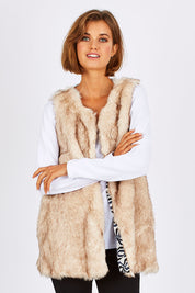 Model Nikki wearing size S of the Faux Fur Vest in colour Fur, from the front, cropped image