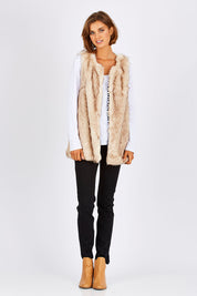 Model Nikki wearing size S of the Faux Fur Vest in colour Fur, from the front, showing the whole outfit