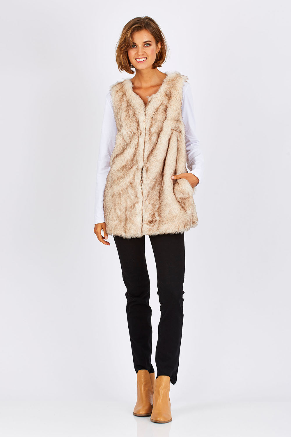 Model Nikki wearing size S of the Faux Fur Vest in colour Fur, from the front, showing the whole outfit