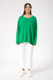 A model wearing the Haven Jumper in colour Oasis (Green), from the front, showing the whole outfit