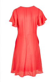 Product shot of the Baja Dress in colour Punch (Red), from the back
