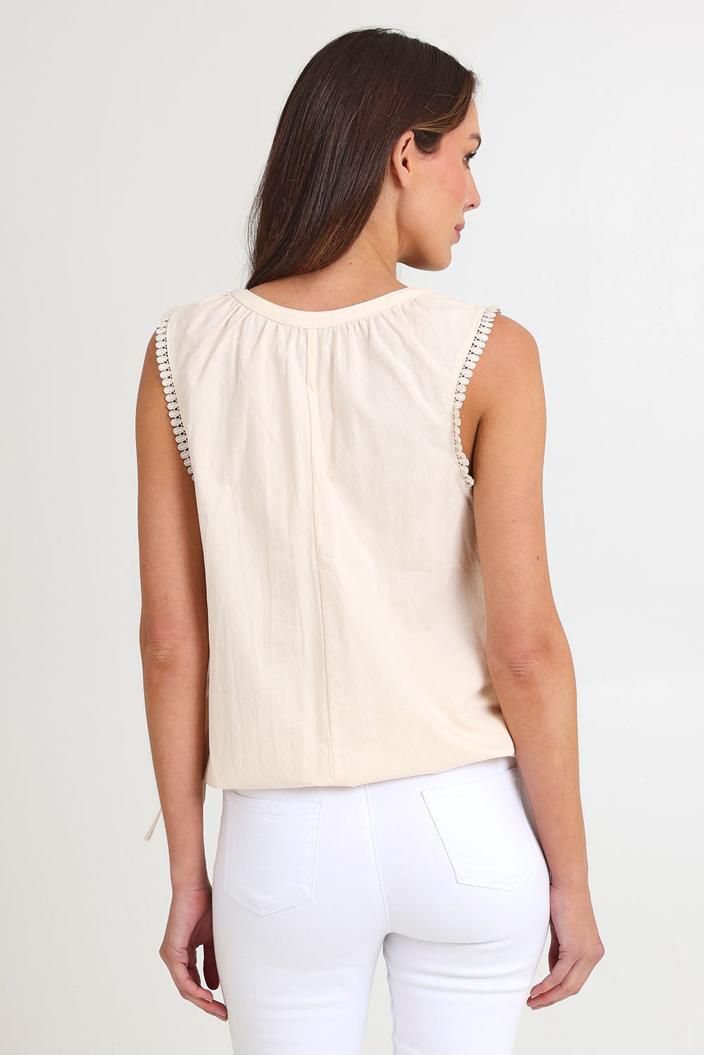 Model Madeline wearing size S of the Santos Cotton Top in colour Bisque, from the back