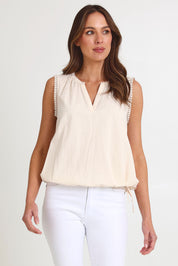 Model Madeline wearing size S of the Santos Cotton Top in colour Bisque, from the front, cropped image