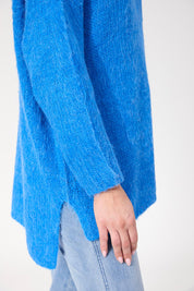 A model wearing the Lyon Relaxed Jumper in colour Cobalt (Blue), from the front, cropped image
