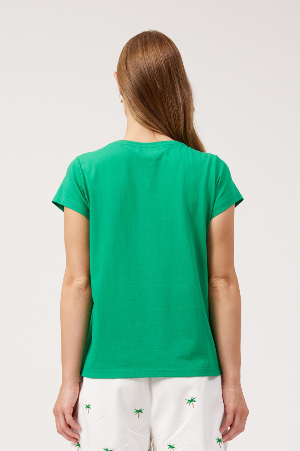 Model Genericm wearing size sample of the Congo Graphic Tee – Green in colour Green, from the back