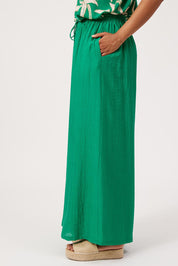 Model Genericm wearing size sample of the Kenya Palazzo Pant – Green in colour Green, from an angle