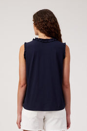 Model Genericm wearing size sample of the Athens Frill Tank – Navy in colour Navy, from the back