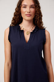Model Genericm wearing size sample of the Athens Frill Tank – Navy in colour Navy, in a cropped view