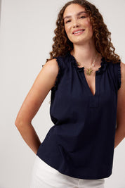 Model Genericm wearing size sample of the Athens Frill Tank – Navy in colour Navy, in a cropped view