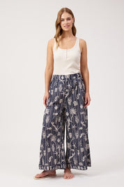 Model Genericm wearing size sample of the Crete Pant – Sea in colour Sea, from the front