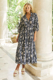 Model Genericm wearing size sample of the Crete Tiered Maxi Dress – Sea in colour Sea, from the front