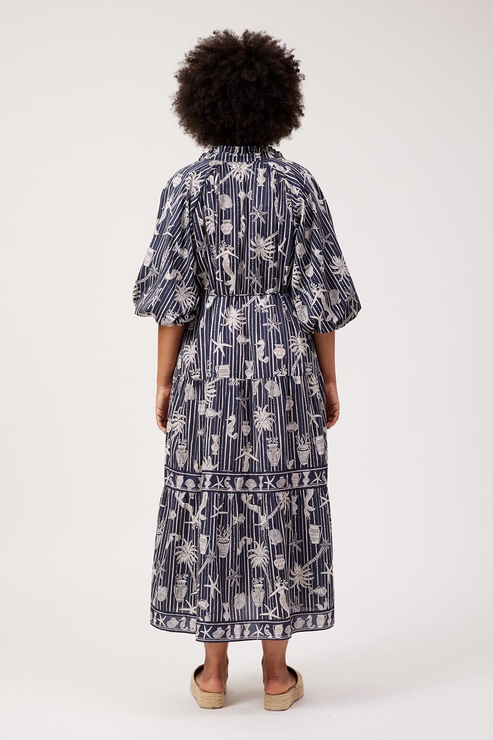 Model Genericm wearing size sample of the Crete Tiered Maxi Dress – Sea in colour Sea, from the front