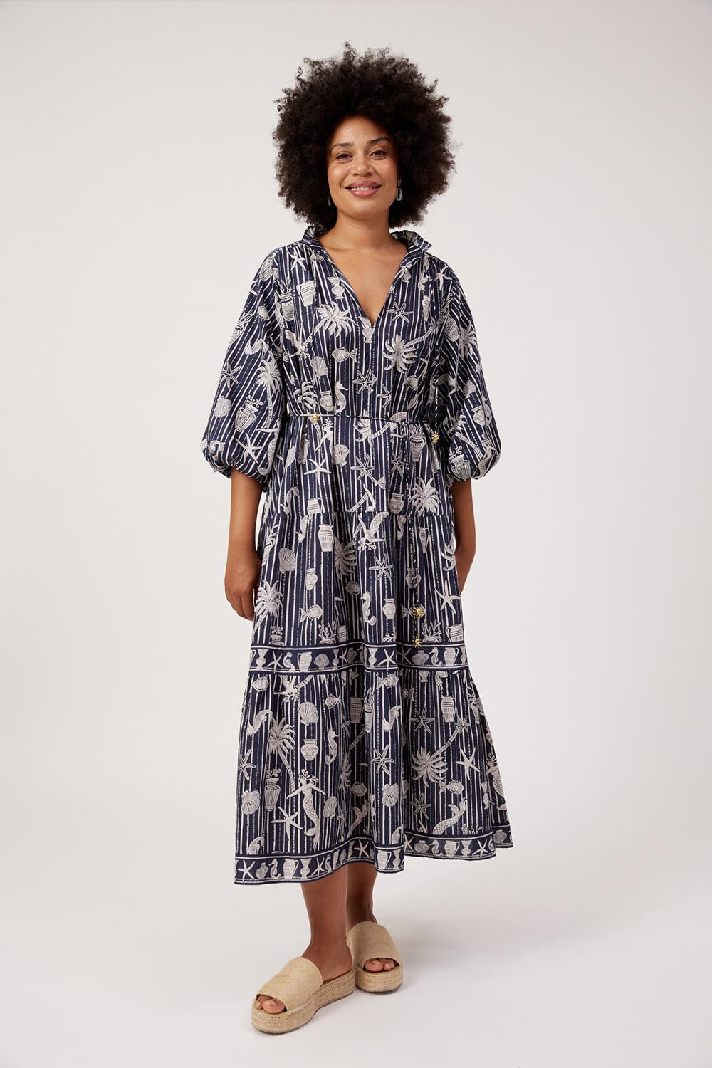 Model Genericm wearing size sample of the Crete Tiered Maxi Dress – Sea in colour Sea, from the front