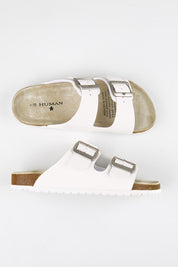 Model Genericm wearing size sample of the Ibiza Slide - White in colour White, from an angle