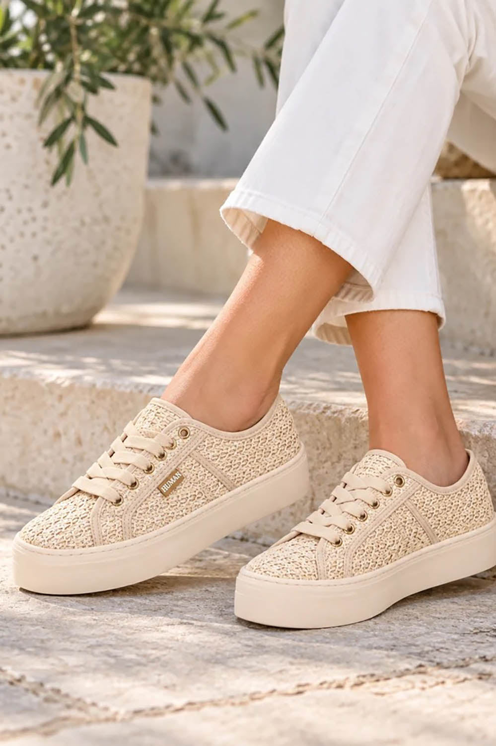 Product shot of the Lift Platform Raffia Sneaker - Natural in colour Natural, from the front