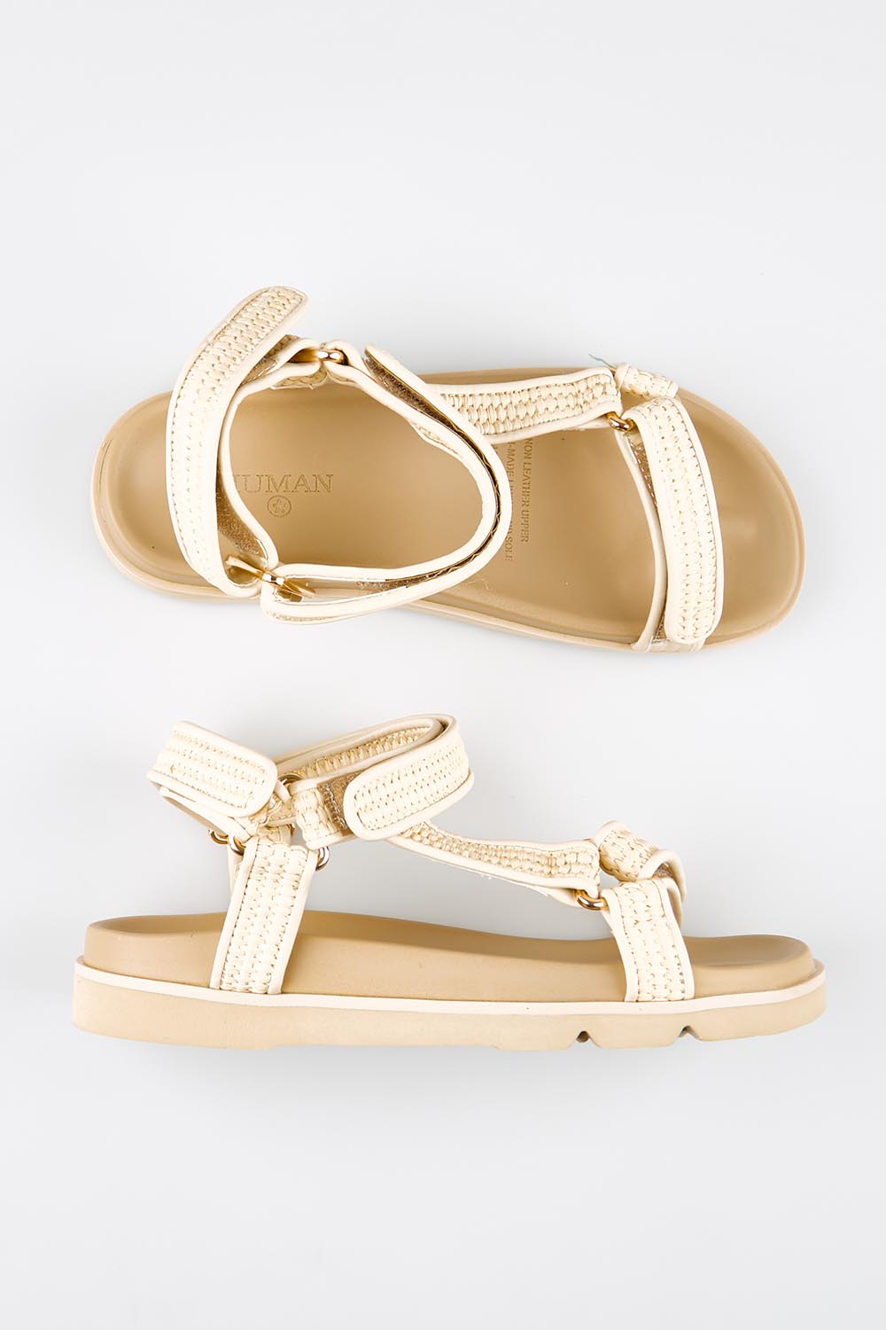 Model Genericm wearing size sample of the Reva Sandal - Natural in colour Natural, from an angle