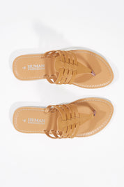 A model wearing size 37 of the Sonya Thong Sandal in colour Tan, from the front, showing the whole outfit