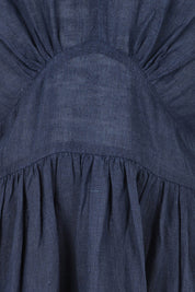 Product shot of the Blossom Linen Dress in colour Navy (Blue), detail