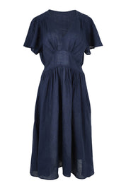 Product shot of the Blossom Linen Dress in colour Navy (Blue), from the front