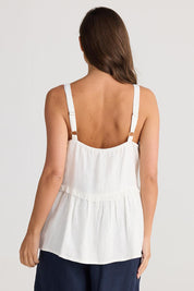 A model wearing the Alita Linen Top in colour White (White), from the back