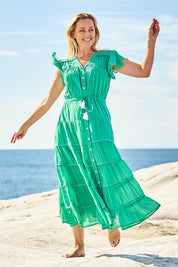 Model Bianca wearing size S of the Delilah Cotton Dress in colour Jadegreen (Green), from the front, showing the whole outfit