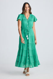 A model wearing the Delilah Cotton Dress in colour Jadegreen (Green), from the front, showing the whole outfit