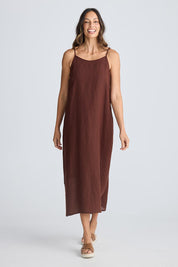 A model wearing the Cliffside Linen Maxi Dress in colour Chocolate, from the front, showing the whole outfit