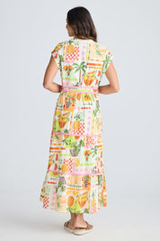 A model wearing the Avery Cotton Maxi Dress in colour Tropical, from the back