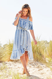 Model Riina wearing size S of the Sweet William Dress in colour PetiteDais (Blue), from the front, showing the whole outfit