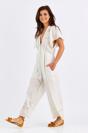 Model Chesska wearing size S of the Blackpool Jumpsuit in colour White (White), from the front, showing the whole outfit